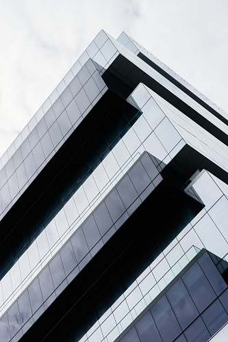 office building low angle photo of buildings architecture